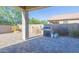 Backyard with patio, grill and artificial turf at 13606 W Desert Moon Way, Peoria, AZ 85383