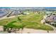 Community view showcasing a golf course and residential homes at 14539 W Sheridan St, Goodyear, AZ 85395