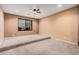 Large bedroom with neutral walls and carpeted floor at 14539 W Sheridan St, Goodyear, AZ 85395