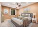 Spacious bedroom with ceiling fan and neutral decor at 14539 W Sheridan St, Goodyear, AZ 85395