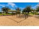 Community playground with swings and shaded area at 14539 W Sheridan St, Goodyear, AZ 85395
