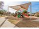 Modern playground with shade structure at 14539 W Sheridan St, Goodyear, AZ 85395