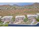 Aerial view showcasing a community of homes nestled in a mountain setting at 14850 E Grandview Dr # 242, Fountain Hills, AZ 85268