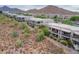 Aerial view of homes in a gated community with mountain views at 14850 E Grandview Dr # 242, Fountain Hills, AZ 85268