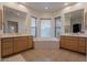 Elegant bathroom with double sinks, large soaking tub, and tile flooring at 14850 E Grandview Dr # 242, Fountain Hills, AZ 85268
