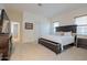Spacious Primary bedroom with a king-size bed, and access to another room and balcony at 14850 E Grandview Dr # 242, Fountain Hills, AZ 85268