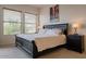 Spacious primary bedroom with large windows and a comfortable bed at 14850 E Grandview Dr # 242, Fountain Hills, AZ 85268