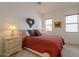 Cozy bedroom with a comfortable bed, nightstands, and charming wall decor at 14850 E Grandview Dr # 242, Fountain Hills, AZ 85268