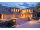 Luxury home with three-car garage, and beautiful desert landscaping at dusk at 14850 E Grandview Dr # 242, Fountain Hills, AZ 85268