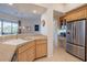 Updated kitchen with stainless steel appliances and granite countertops at 14850 E Grandview Dr # 242, Fountain Hills, AZ 85268