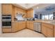 Modern kitchen with stainless steel appliances and light wood cabinets at 14850 E Grandview Dr # 242, Fountain Hills, AZ 85268
