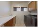 Laundry room with washer, dryer, and utility sink at 14850 E Grandview Dr # 242, Fountain Hills, AZ 85268