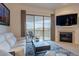 Living area features a fireplace, balcony access and stunning views at 14850 E Grandview Dr # 242, Fountain Hills, AZ 85268