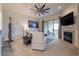 Relaxing living room with fireplace, comfortable seating and access to balcony at 14850 E Grandview Dr # 242, Fountain Hills, AZ 85268