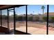 Spacious backyard with gravel landscaping, fire pit, and screened patio at 17020 N 125Th Ave, Sun City West, AZ 85375