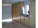 Attached garage with extra storage cabinets and open space at 17020 N 125Th Ave, Sun City West, AZ 85375