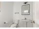 Modern bathroom with pedestal sink and updated vanity at 19668 E Carriage Way, Queen Creek, AZ 85142