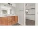 Bathroom with double vanity and walk-in closet access at 19668 E Carriage Way, Queen Creek, AZ 85142