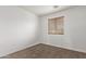 Simple bedroom with a window and carpet flooring at 19668 E Carriage Way, Queen Creek, AZ 85142