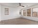 Spacious bedroom with ceiling fan and neutral carpeting at 19668 E Carriage Way, Queen Creek, AZ 85142