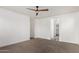 Bedroom with ceiling fan and access to a walk-in closet at 19668 E Carriage Way, Queen Creek, AZ 85142