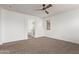 Bright bedroom with ceiling fan and carpet flooring at 19668 E Carriage Way, Queen Creek, AZ 85142