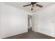 Bedroom with carpet flooring and access to upper level at 19668 E Carriage Way, Queen Creek, AZ 85142