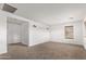 Large bedroom with neutral carpeting and two wall sconces at 19668 E Carriage Way, Queen Creek, AZ 85142
