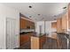 Spacious kitchen with island and ample wood cabinetry at 19668 E Carriage Way, Queen Creek, AZ 85142