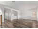 Large living room with hardwood floors and neutral walls at 19668 E Carriage Way, Queen Creek, AZ 85142