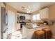 Kitchen with an island, granite countertops, and white cabinets at 19933 E San Tan Blvd, Queen Creek, AZ 85142