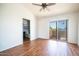 Spacious bedroom with wood-look flooring, private access to balcony, and en-suite bathroom at 2020 W Union Hills Dr # 246, Phoenix, AZ 85027
