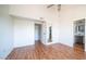 Bright bedroom with wood-look flooring and access to bathroom at 2020 W Union Hills Dr # 246, Phoenix, AZ 85027
