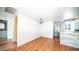 Dining area with wood-look flooring and view into kitchen at 2020 W Union Hills Dr # 246, Phoenix, AZ 85027