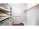 Bright, spacious closet with built in shelves and hanging rods at 2020 W Union Hills Dr # 246, Phoenix, AZ 85027