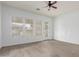 Living room featuring hardwood floors and multiple windows at 20244 E Silver Creek Ln, Queen Creek, AZ 85142