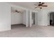 Main bedroom with ceiling fans and access to additional room at 20244 E Silver Creek Ln, Queen Creek, AZ 85142