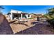 Landscaped backyard with patio and seating area at 21171 E Stirrup St, Queen Creek, AZ 85142