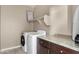 Laundry room with washer, dryer, and cabinets at 22302 E Camina Plata --, Queen Creek, AZ 85142