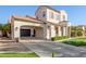 Two-story house with attached garage and a nicely landscaped front yard at 22851 S 204Th St, Queen Creek, AZ 85142