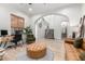 Bright living room with hardwood floors, a staircase, and a comfortable seating area at 22851 S 204Th St, Queen Creek, AZ 85142