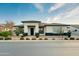 Modern single-story home with a clean, white exterior and landscaped front yard at 23075 E Stonecrest Dr, Queen Creek, AZ 85142