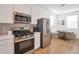 Modern kitchen with stainless steel appliances and breakfast nook at 23152 E Twilight Dr, Queen Creek, AZ 85142