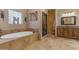 Bathroom with soaking tub, walk-in shower, and double vanity at 23323 S 199Th Pl, Queen Creek, AZ 85142