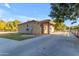 House exterior showcasing a driveway and landscaping at 23323 S 199Th Pl, Queen Creek, AZ 85142