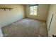 Simple bedroom with carpet flooring and a window at 2517 E Sahuaro Dr, Phoenix, AZ 85028