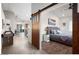 Main bedroom with a barn door entry and plush bedding at 3224 E Desert Cove Ave, Phoenix, AZ 85028