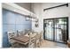 Modern dining room with a light and airy feel, and sliding glass doors leading to the backyard at 3224 E Desert Cove Ave, Phoenix, AZ 85028