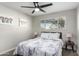 Bedroom with a queen bed, ceiling fan, and wood nightstands at 331 E Pierce St, Tempe, AZ 85288