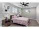 Bedroom with a queen bed, ceiling fan, and wood nightstands at 331 E Pierce St, Tempe, AZ 85288